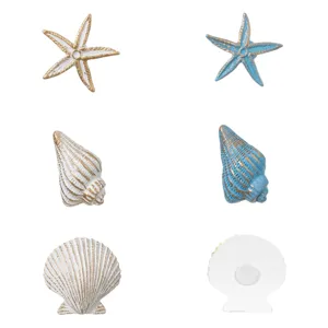 Set 6 autocolante decorative cu stele de mare și scoici, 4.5 cm, alb și albastru cu detalii aurii