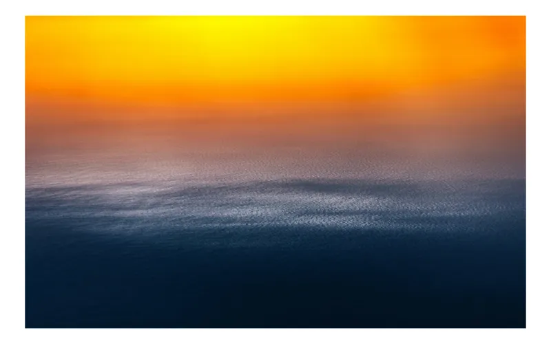 Tablou Canvas Apus de foc peste ocean liniștit, 70 x 50 cm